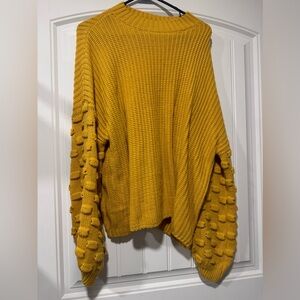 Oversized sweater with detailed sleeves